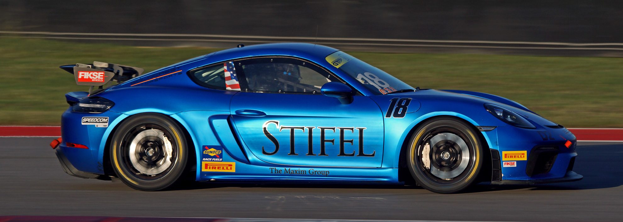Image of blue race car with Stifel | The Maxim Group on the side